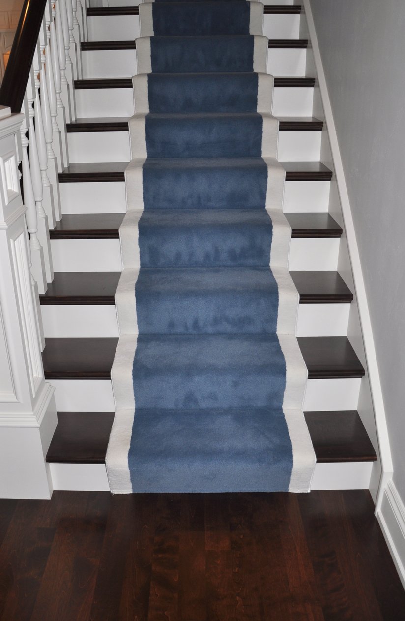 Carpet runners help create a flow between hardwood floors and hardwood staircases.