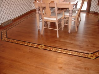 Hardwood floor borders can be used to frame an area within a room.